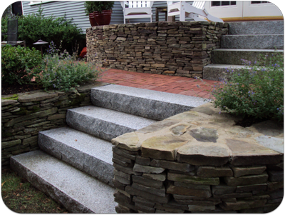 Picture of stone wall, granite steps, brick walkway