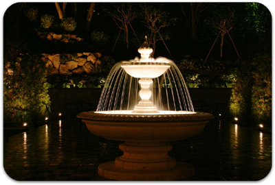 Picture of a fountain with landscape lighting
